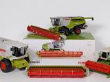 four different models of farm machinery in a box