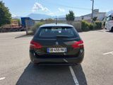 a black car that is parked in a parking lot
