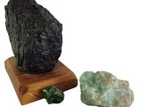 a rock that is sitting next to a rock on a wooden stand