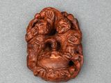 a close up of a small carved object on a table