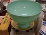 several bowls and plates are stacked on top of each other on a table