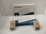 two boxes of electronic equipment sitting on a white surface