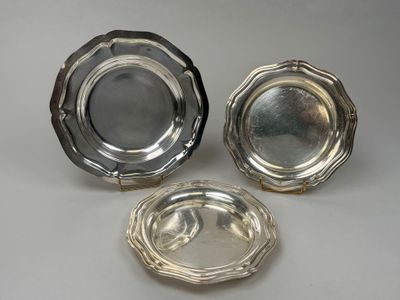 three silverplated dishes on a white background