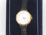 a watch that is sitting on top of a velvet case