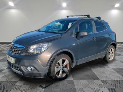 the blue suv is parked in a large room with a checkered floor