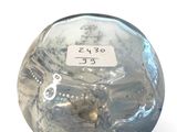 an image of a glass vase with a label on it