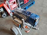 a machine that is sitting on a cart in a garage