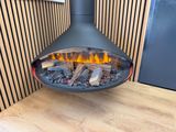 a close up of a fireplace with a fire inside of it