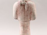 an image of a statue of a woman with a bow on her head