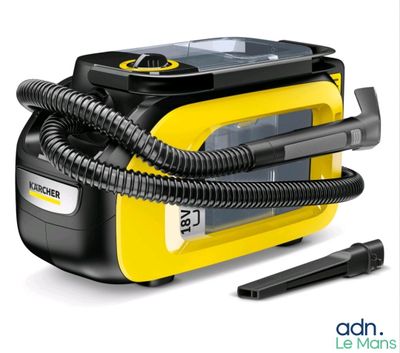 the yellow and black steam cleaner is sitting next to a black and white device