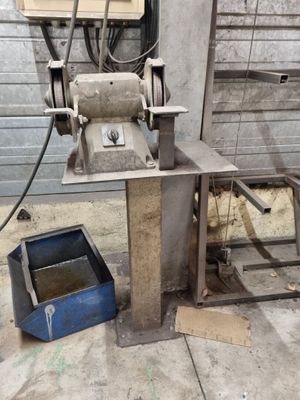 a machine that is sitting on the ground next to a box