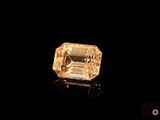 a yellow diamond is shown on a black surface