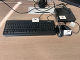a keyboard, mouse, and mouse pad on a desk
