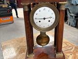 a clock that is sitting on top of a table