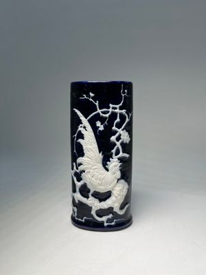 chinese black and white porcelain vase with a dragon on a branch