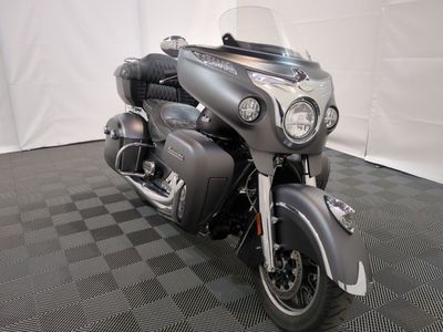 a motorcycle that is parked on a checkered floor