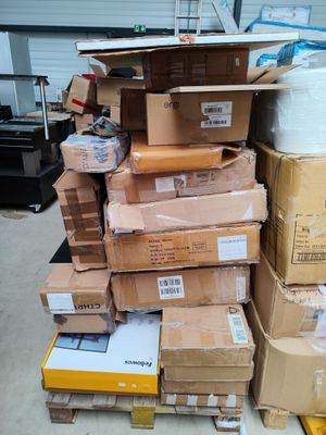 many boxes stacked on top of each other in a warehouse
