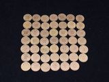 a lot of coins sitting on a black surface