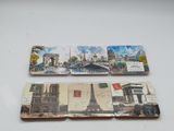 two pieces of paper with pictures on them on a table
