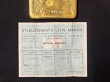 gold bar on a black background with a receipt for a gold bar