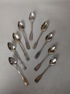 a lot of spoons arranged in a circle on the table
