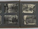 an old photo of a book with pictures of a city in it