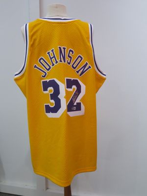 a yellow basketball jersey with the number 32 on it