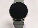 a smart watch that is sitting on top of a stand