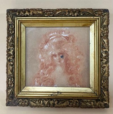 painting of a young girl in a gold frame on a white wall