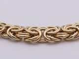 a gold chain necklace with a clasp
