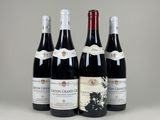 trois bouteilles de vin sont alignées sur une table