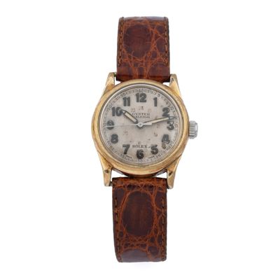 a close up of a watch on a white background with a brown strap