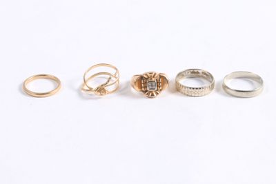 five different types of rings are shown on a white surface