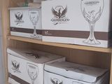many boxes of wine on a shelf in a room