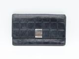black leather wallet with a metal clasp on a white background