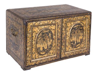 an ornately decorated chest with two doors and two drawers