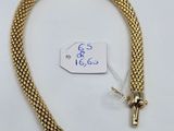 a close up of a gold chain with a tag on it