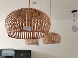 three lamps hanging from the ceiling in a living room