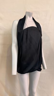 the mannequin is wearing a black top and white leggings
