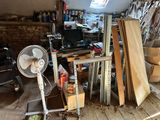 a room with a lot of wood and a fan in it