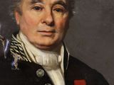 portrait of a man in a military uniform holding a medal