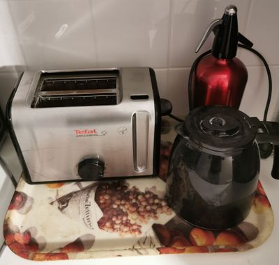 a toaster and a kettle sitting on a kitchen counter