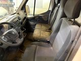 a car that is sitting in a dirty room