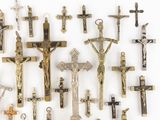 many different types of crucifs displayed on the wall