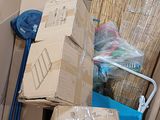many boxes stacked on top of each other in a room