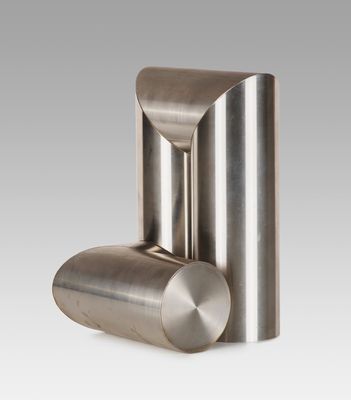 a close up of a stainless steel object on a white background