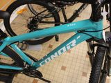 a blue bike that is on display in a store