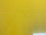 a close up of a yellow book on a table