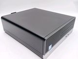 an image of a small black computer on a white surface