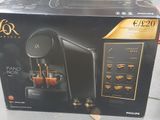 boxed box of a coffee machine sitting on the floor